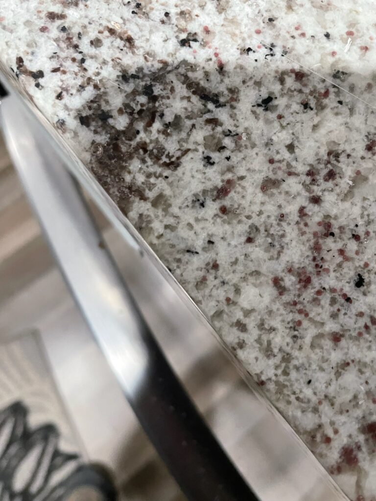 The same granite countertop after being repaired by a Tops Solid Surface service technician