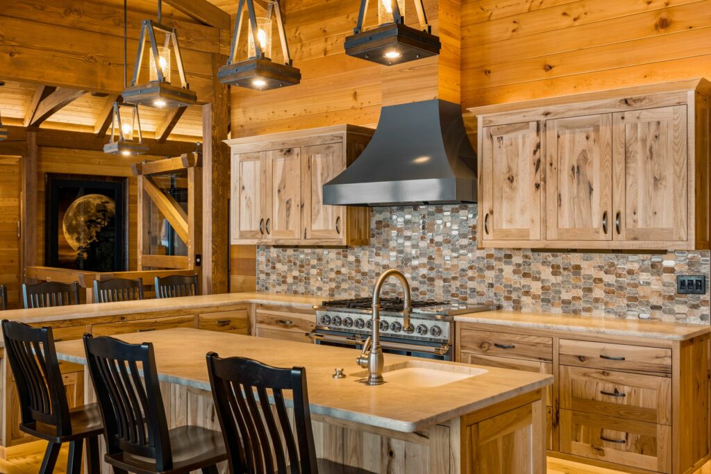 Natural stone countertops with natural wood finish cabinetry can often get you the same look as butcher block with less maintenance. Check out this rustic cabin design. 