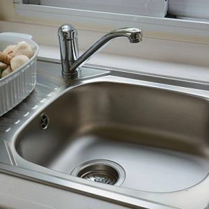A stainless steel topmount kitchen sink. Affordable, easy to clean and easy to maintain. 